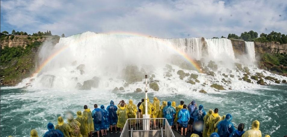 View from boat deck looking up at Horseshoe Falls at Niagara with rainbow in the mist